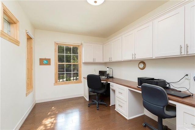 701 S Parker Rd S, La Feria, TX 78559 - office space featuring built in study area, dark wood finished floors, and baseboards