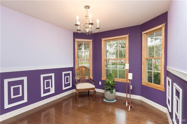 701 S Parker Rd S, La Feria, TX 78559 - living area with a chandelier, wood finished floors, and baseboards