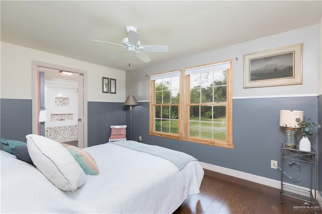 701 S Parker Rd S, La Feria, TX 78559 - bedroom with wood finished floors, baseboards, a ceiling fan, and connected bathroom