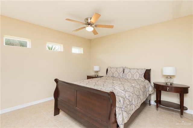701 S Parker Rd S, La Feria, TX 78559 - bedroom with baseboards, a ceiling fan, and light tile patterned floors