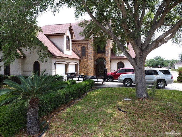 2206 Highland Dr, Weslaco, TX 78599 - view of green lawn featuring a garage and driveway
