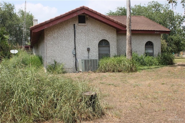 view of home's exterior with a lawn