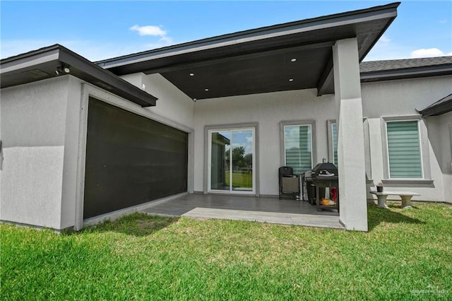 back of house featuring a patio and a lawn