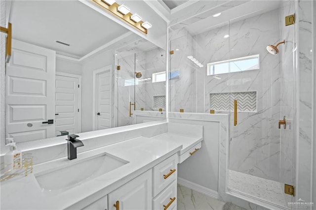 bathroom with a shower with door and vanity