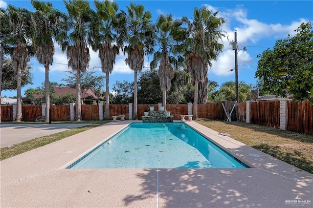 view of swimming pool with a fenced in pool, a fenced backyard, and a patio area