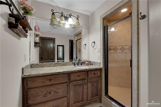 bathroom featuring a stall shower and vanity