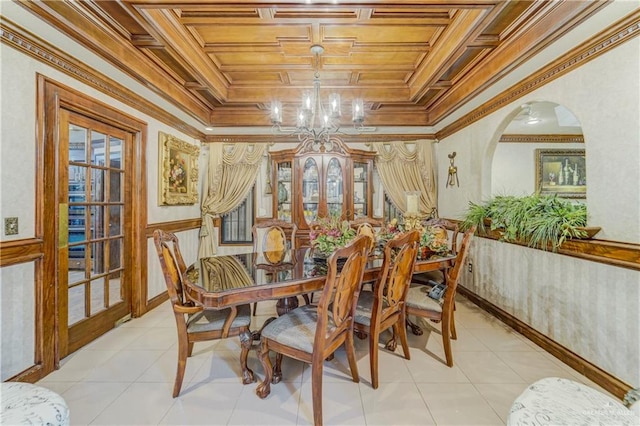 228 Oak Ridge Dr, Rio Grande City, TX 78582 - dining room with arched walkways, a chandelier, crown molding, light tile patterned floors, and healthy amount of natural light