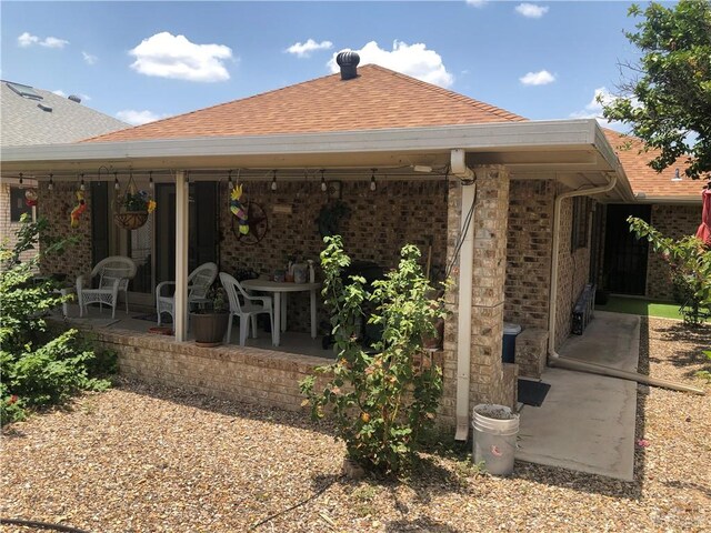 rear view of property featuring a patio