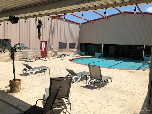 view of swimming pool featuring a patio