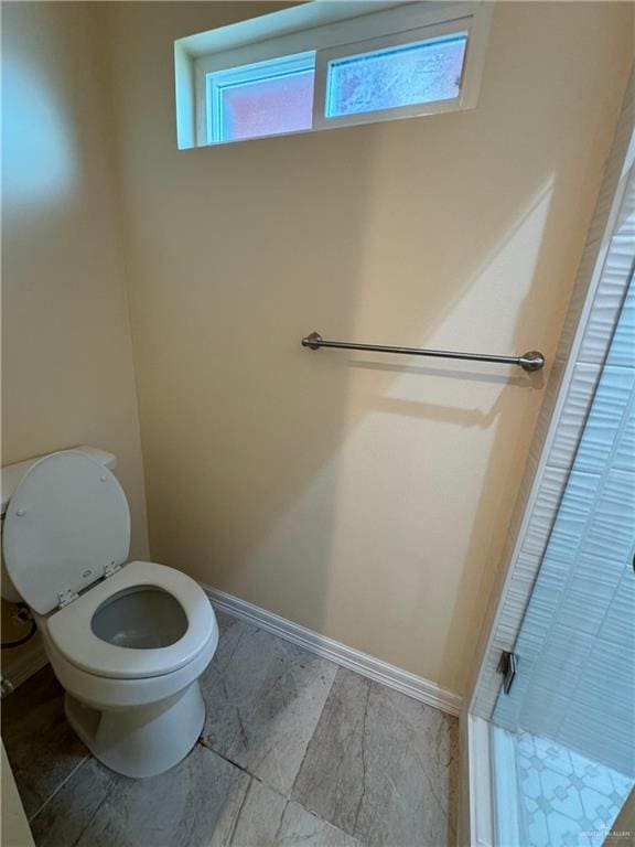 bathroom featuring toilet