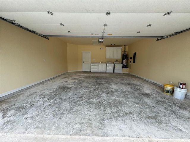 garage featuring independent washer and dryer, electric panel, a garage door opener, and water heater