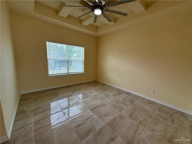 spare room featuring ceiling fan and beamed ceiling