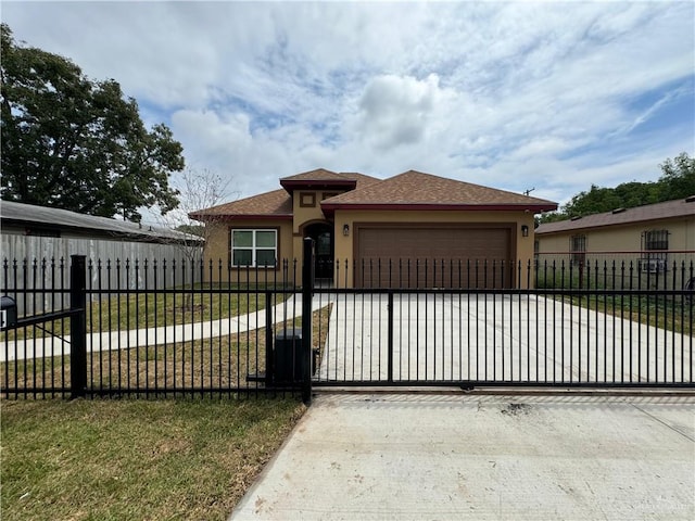 view of front of property featuring a garage and a front lawn