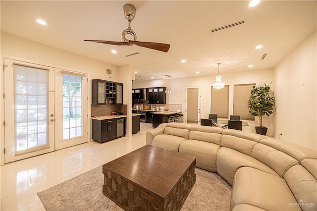 living room with french doors and ceiling fan