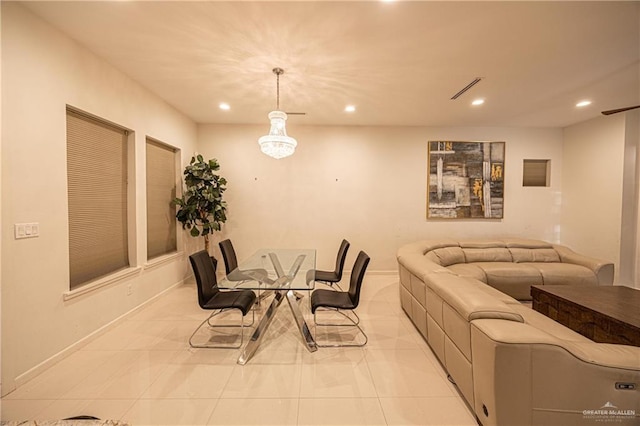 dining area featuring light tile patterned flooring