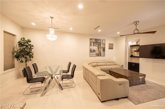 living room with light tile patterned floors and ceiling fan