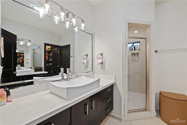 bathroom featuring a stall shower and vanity