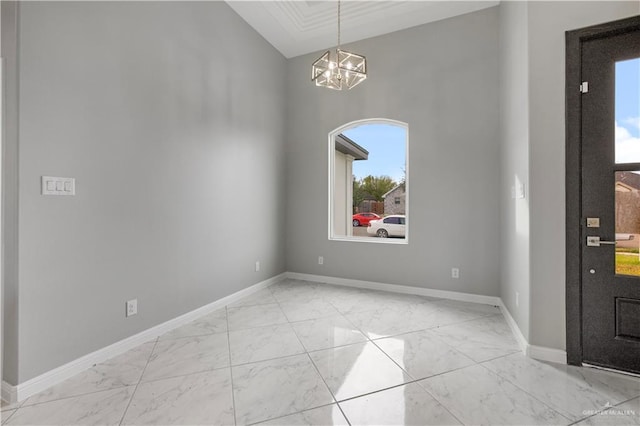 foyer with a chandelier and ornamental molding