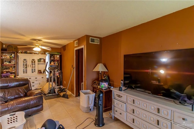 tiled living room featuring ceiling fan