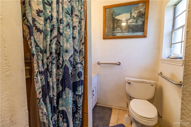 bathroom with tile patterned floors and toilet