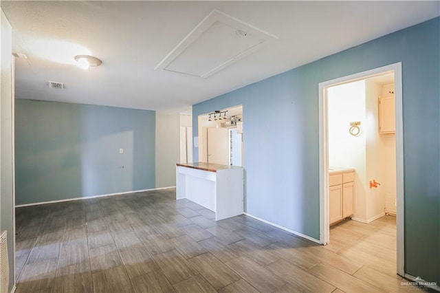 spare room featuring light wood-type flooring