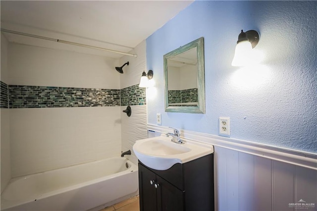 bathroom featuring vanity and tiled shower / bath combo