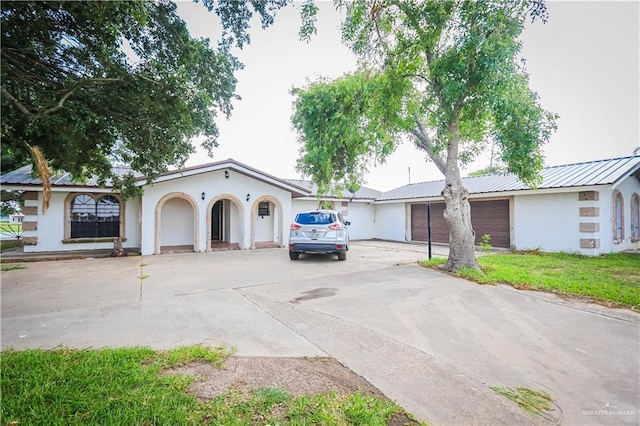 view of front of home with a garage