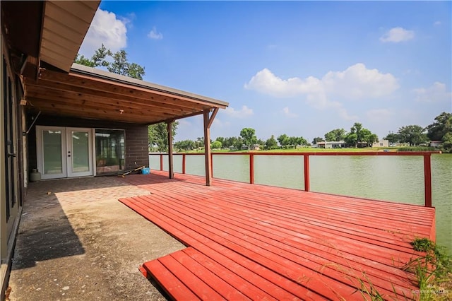 deck featuring french doors and a water view