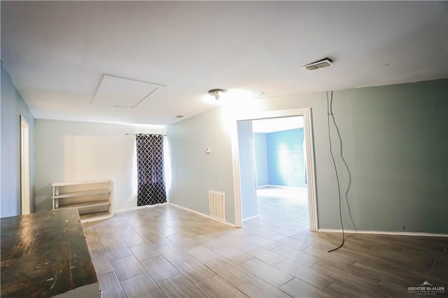 unfurnished room featuring wood-type flooring