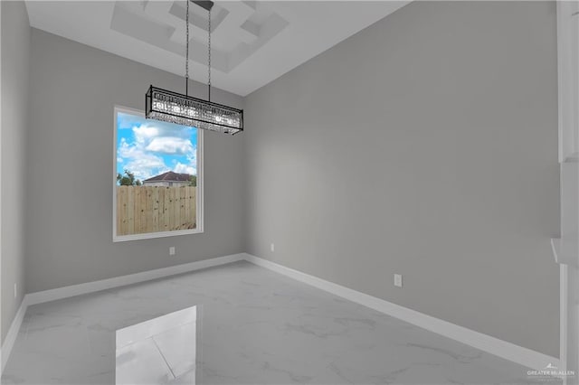 unfurnished dining area with a chandelier