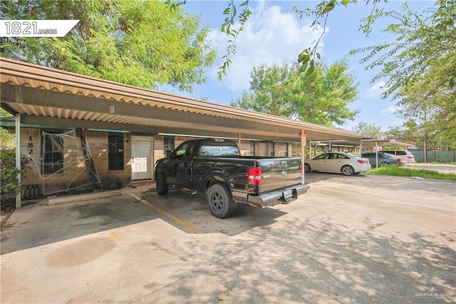 view of vehicle parking featuring a carport