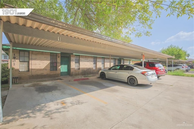 view of vehicle parking featuring a carport