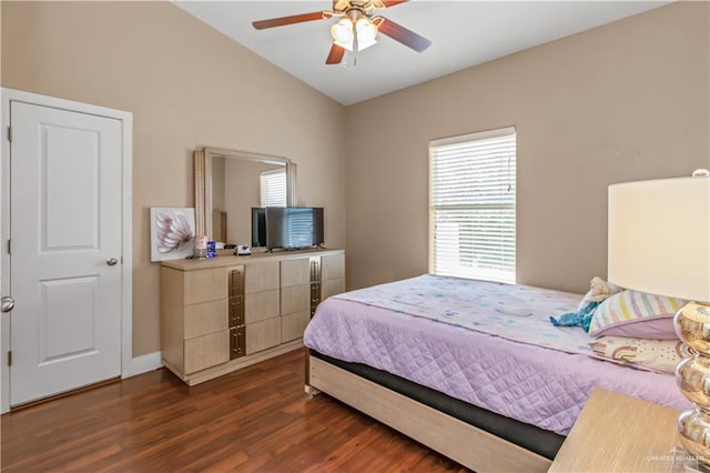 bedroom featuring ceiling fan, dark wood-type flooring, and vaulted ceiling