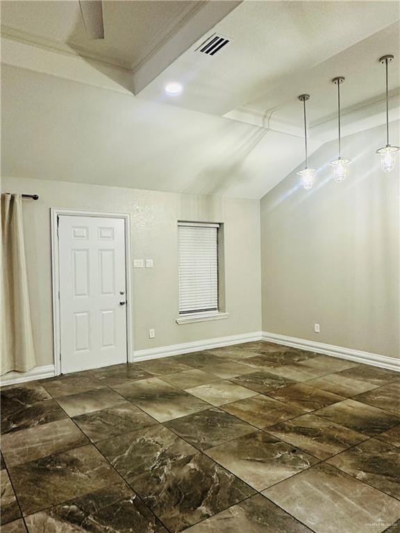 unfurnished room with vaulted ceiling