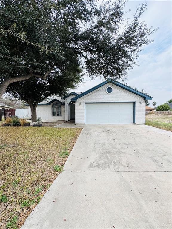 view of front facade with a garage and a front yard