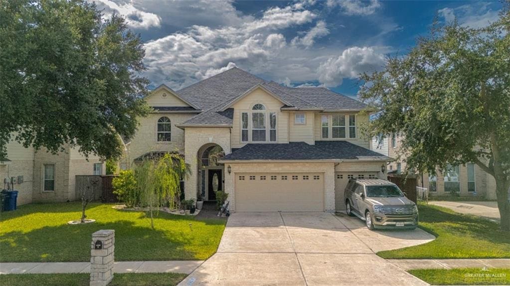 view of front facade featuring a garage and a front lawn