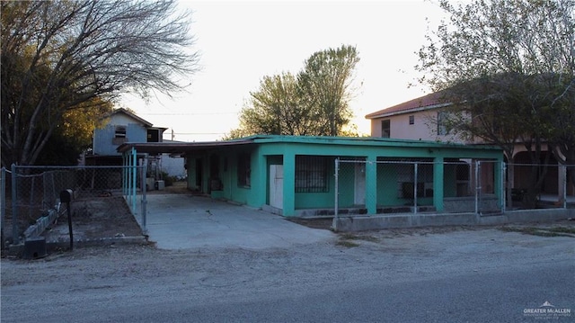 rear view of property with a carport