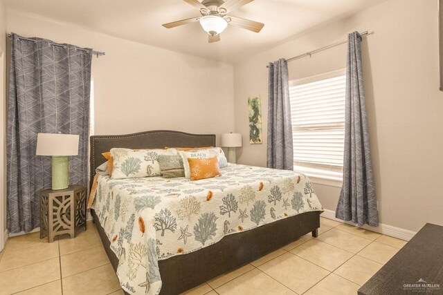 tiled dining space featuring ceiling fan with notable chandelier and ornamental molding