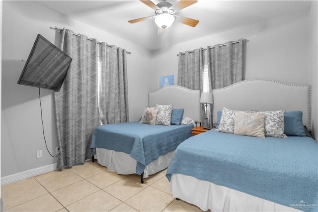 bedroom featuring ceiling fan and light tile patterned flooring