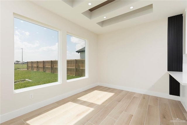 1027 Broken Arrow Dr, Alamo, TX 78516 - unfurnished room featuring plenty of natural light, recessed lighting, wood finished floors, a raised ceiling, and baseboards