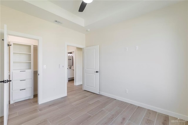 1027 Broken Arrow Dr, Alamo, TX 78516 - unfurnished bedroom featuring light wood-style floors, baseboards, and ceiling fan