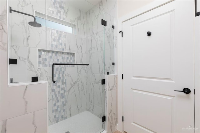 1027 Broken Arrow Dr, Alamo, TX 78516 - bathroom featuring a marble finish shower