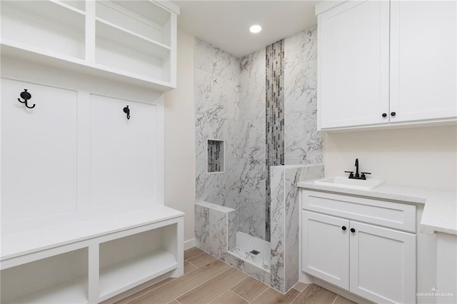 1027 Broken Arrow Dr, Alamo, TX 78516 - mudroom featuring a sink, wood finish floors, and recessed lighting