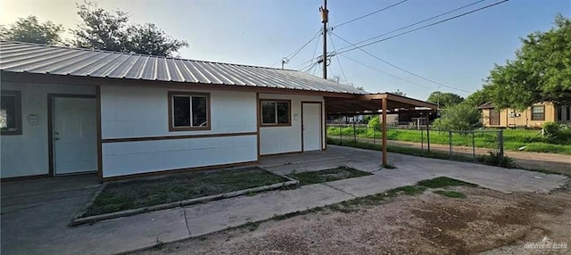 view of side of property featuring a carport