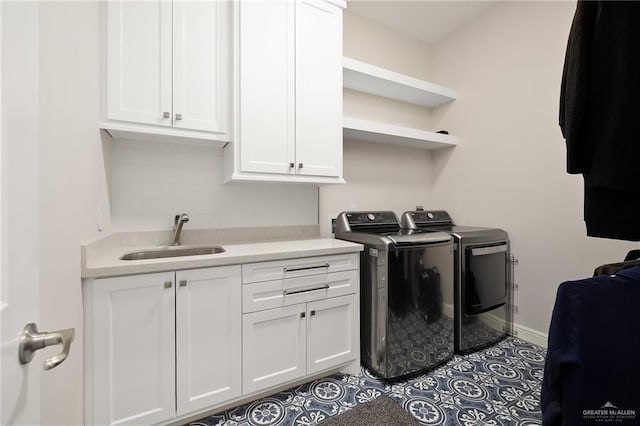 8101 N 5th St, Mcallen, TX 78504 - clothes washing area featuring independent washer and dryer, a sink, cabinet space, and baseboards