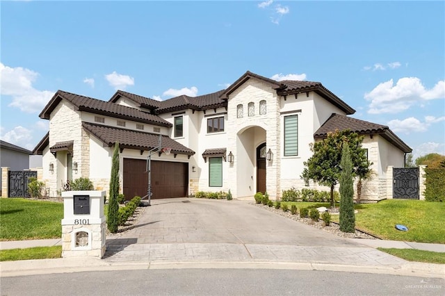 view of front of home featuring a tile roof, stone siding, concrete driveway, stucco siding, and a front lawn