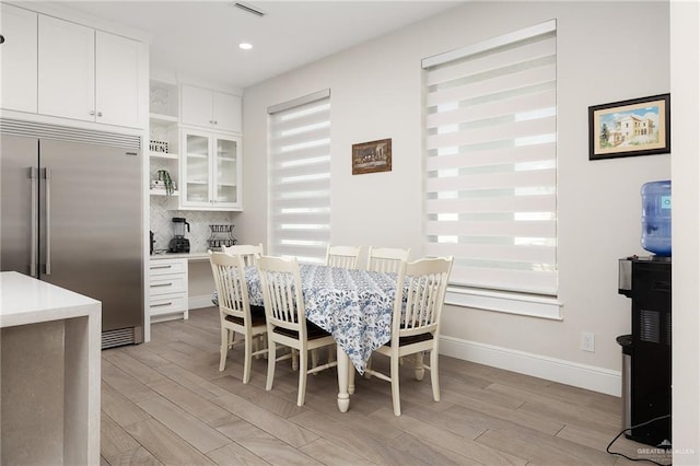 8101 N 5th St, Mcallen, TX 78504 - dining space with light wood-type flooring, visible vents, baseboards, and recessed lighting