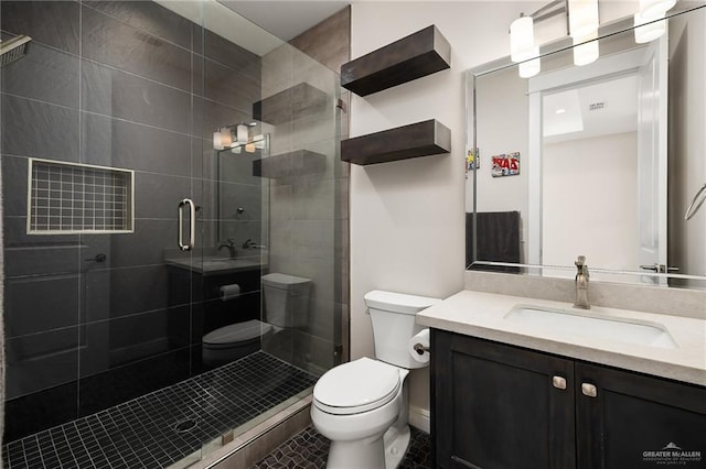 8101 N 5th St, Mcallen, TX 78504 - bathroom with vanity, a shower stall, and toilet
