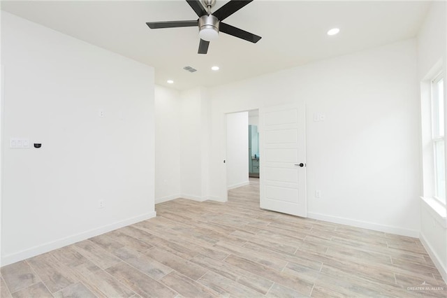 unfurnished room featuring ceiling fan and light wood-type flooring