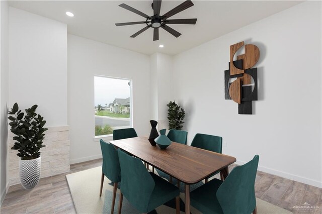 dining area featuring ceiling fan and light wood-type flooring